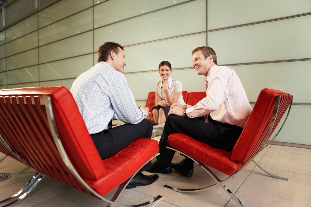 Smiling Businesspeople Having Meeting